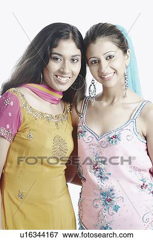 Stock Photo - Portrait of two young women smiling. Fotosearch