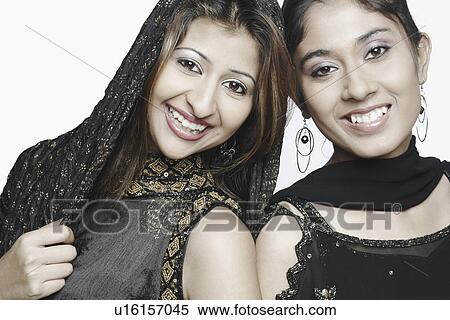 Stock Photography - Portrait of two young women smiling. Fotosearch