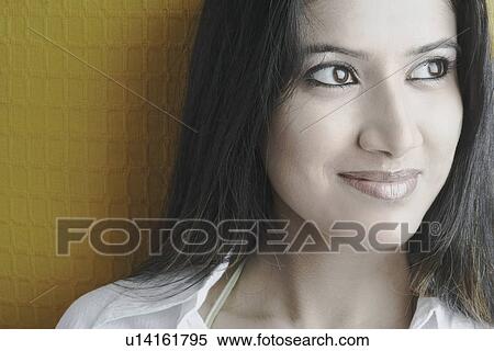 Stock Photography - Close-up of a young woman smiling. Fotosearch