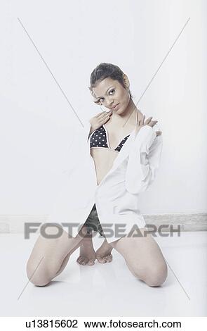 Stock Image - Portrait of a young woman posing. Fotosearch