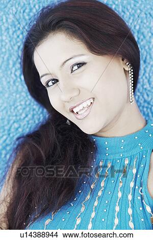 Portrait of a young woman smiling View Large Photo Image Picture - Portrait of a young woman smiling. Fotosearch