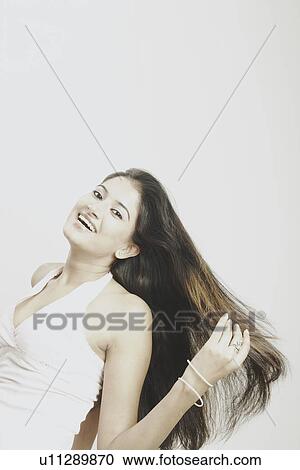 Portrait of a young woman smiling View Large Photo Image Stock Image - Portrait of a young woman smiling. Fotosearch
