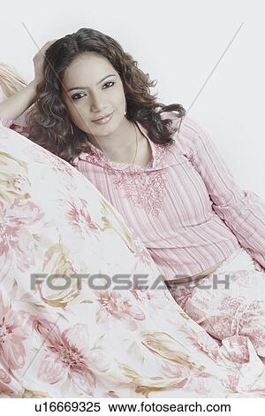Stock Photography - Portrait of a young woman smiling. Fotosearch