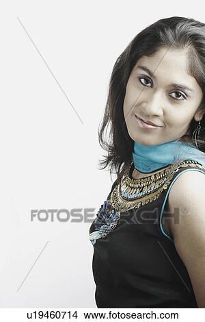 Picture - Side profile of a young woman smiling. Fotosearch