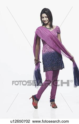 Stock Image - Young woman holding a scarf. Fotosearch