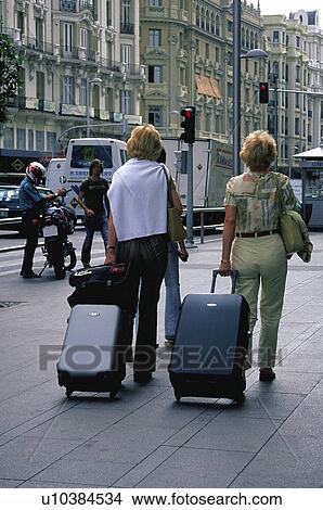 Case, Cases, Suitcase, Suitcases, Trolley, Trolleys, Woman View Large Photo Image Picture - Case, Cases, Suitcase, Suitcases, Trolley, Trolleys, Woman. Fotosearch