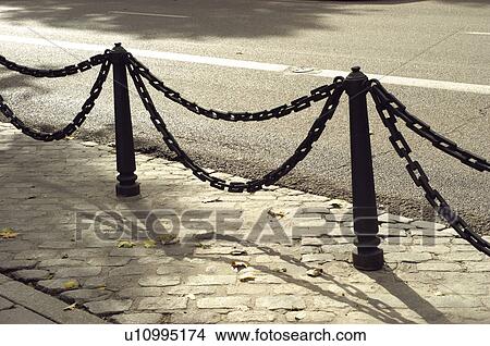 Picture - Urban, Urban details, Bollard, Bollards, Chain, Chains, Shadow. Fotosearch