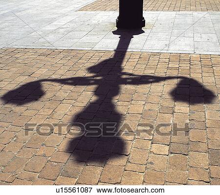 Stock Photo - Urban, Urban details, Floor, Paved, Paving, Shadow, Lamppost. Fotosearch