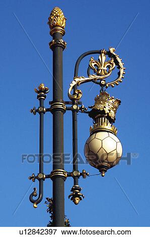 Stock Photo - Urban, Urban details, Light, Lamppost, Street light, Wrought iron, Iron. Fotosearch
