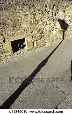 Stock Image - Urban, Urban details, Street Light, Lamppost, Light, Shadow, Wall. Fotosearch