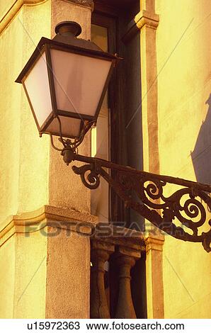 Stock Image - Urban, Urban details, Wall, Shadow, Lamppost, Light, Street light. Fotosearch