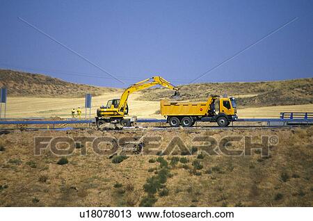 Stock Image - Construction, In construction, Building site, Construction site, Digger, Ground, Dig. Fotosearch
