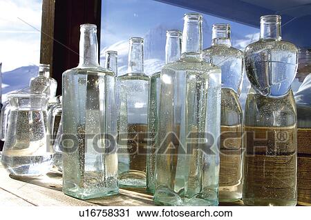 Stock Image - Bottle, Bottles, Empty, Glass, Empty bottles, Window, Jar. Fotosearch