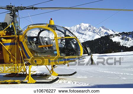 Stock Photo - Snow, Snowy, Winter, Snow details, Helicopter, Transport, Air transport. Fotosearch