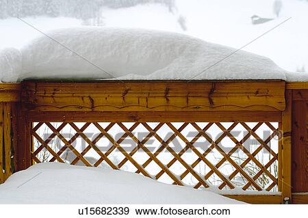 Stock Photo - Snow, Snowy, Winter, Snow details, Fence, Wood, Wooden fence. Fotosearch