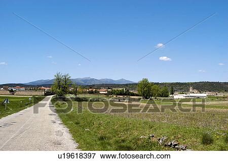 Stock Photo - Road, Roads, Spanish, Spanish road, Spanish roads, Straight, Village. Fotosearch