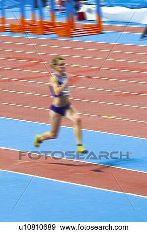 Stock Photo -  Sport, Sports, Sportswoman, Woman, Sport clothes, Racetrack. Fotosearch