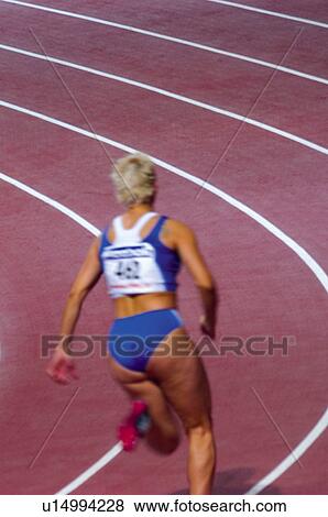 Stock Photo -  Sport, Sports, Sportswoman, Woman, Sport clothes, Racetrack. Fotosearch
