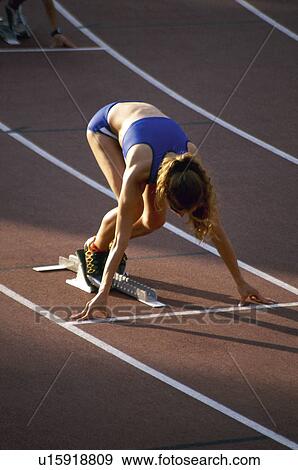 Stock Photo -  Sport, Sports, Sportswoman, Woman, Sport clothes, Racetrack. Fotosearch
