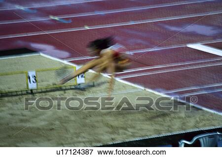 Stock Photo -  Sport, Sports, Sportswoman, Woman, Sport clothes, Jump. Fotosearch