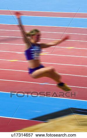 Stock Photo -  Sport, Sports, Sportswoman, Woman, Racetrack, Sport clothes. Fotosearch