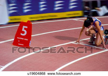Stock Photo -  Sport, Sports, Sportswoman, Woman, Sport clothes, Racetrack. Fotosearch