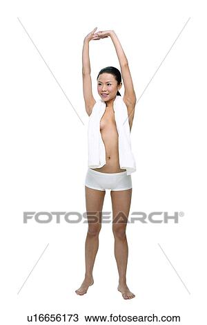 Stock Image - Asian Ethnicity, Black Hair, Barefoot, Arms Raised. Fotosearch