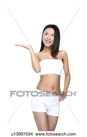 Belly Button, Close-Up, Black Hair, Asian Ethnicity View Large Photo Image Picture - Belly Button, Close-Up, Black Hair, Asian Ethnicity. Fotosearch