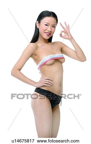 Stock Photo - Ok Sign, White Background, Black Hair, Asian Ethnicity. Fotosearch