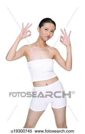Stock Photography - White Background, Hand Sign, One Young Woman Only, Sexy & Slim, Sexy And Slim, Perfection. Fotosearch