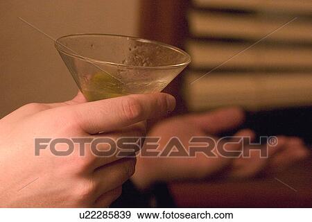 Full of conversation with martini in hand View Large Photo Image Stock Photo - Full of conversation with martini in hand. Fotosearch