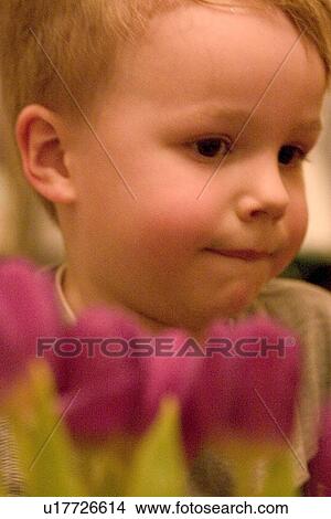 A four year old boy having a thoughtful moment View Large Photo Image Picture - A four year old boy having a thoughtful moment. Fotosearch