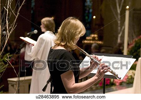 Stock Photography - Flutist playing at the Christmas Pageant. Fotosearch