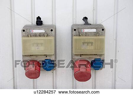 Stock Photo - A pair of color coded outlets at a Polish gas station. Fotosearch