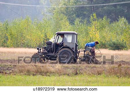 Stock Photo - Farmers working in the field. Fotosearch