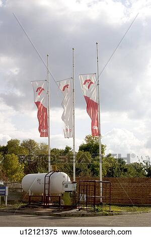 Flags over propane tank at Polish gas station View Large Photo Image Stock Photography - Flags over propane tank at Polish gas station. Fotosearch