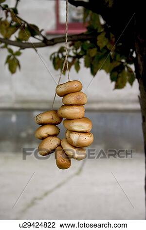 Stock Image - Polish bagels hanging outside. Fotosearch