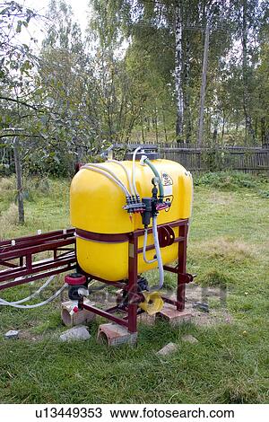 Stock Image - Propane tank in Polish farmyard. Fotosearch