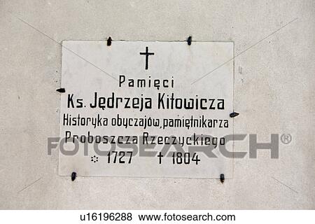 Stock Photo - Sign of dedication on church wall. Fotosearch