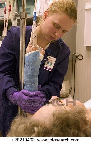 Clinic nurse forming cast on arm of patient with broken wrist View Large Photo Image Stock Image - Clinic nurse forming cast on arm of patient with broken wrist. Fotosearch
