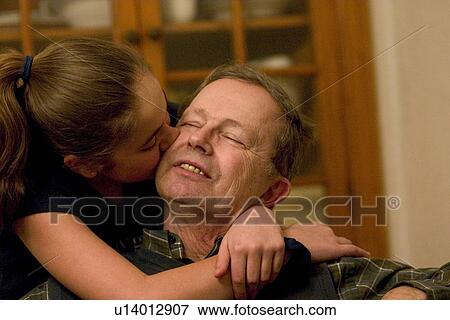 A big happy kiss and hug for grandfather View Large Photo Image Stock Photo - A big happy kiss and hug for grandfather. Fotosearch