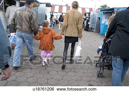 Stock Photograph - Family is shopping at the market. Fotosearch