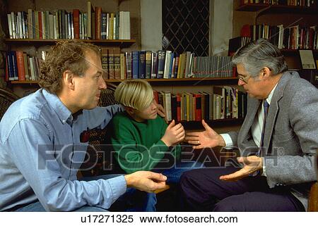 Minister counseling father and son View Large Photo Image Stock Photography - Minister counseling father and son. Fotosearch
