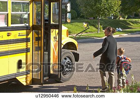 Mom discussing sons ride with bus driver View Large Photo Image Stock Photograph - Mom discussing sons ride with bus driver. Fotosearch