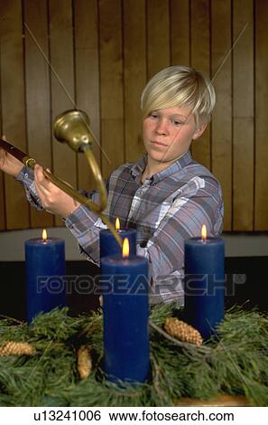 Teenager lighting advent candles in church View Large Photo Image Stock Photograph - Teenager lighting advent candles in church. Fotosearch