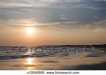 Beach at sunset. View Large Photo Image Stock Image - Beach at sunset.. Fotosearch