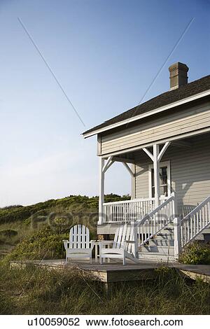 Stock Image - Coastal house with porch and deck on Bald Head Island, North Carolina.. Fotosearch