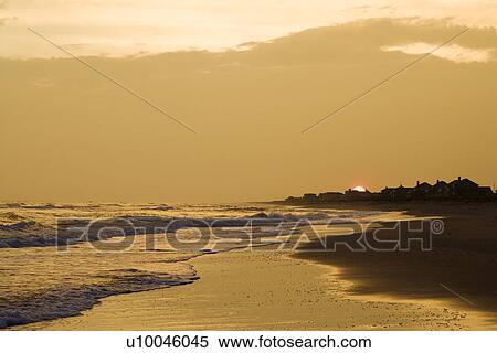 Stock Photography - Golden beach at sunset.. Fotosearch