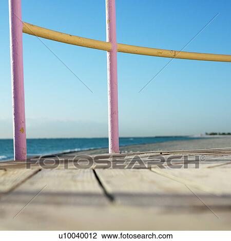 Pink and yellow painted railings of lifeguard tower on beach in Miami, Florida, USA. View Large Photo Image Stock Image - Pink and yellow painted railings of lifeguard tower on beach in Miami, Florida, USA.. Fotosearch