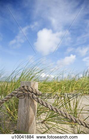 Picture - Rope fence barrier on beach.. Fotosearch